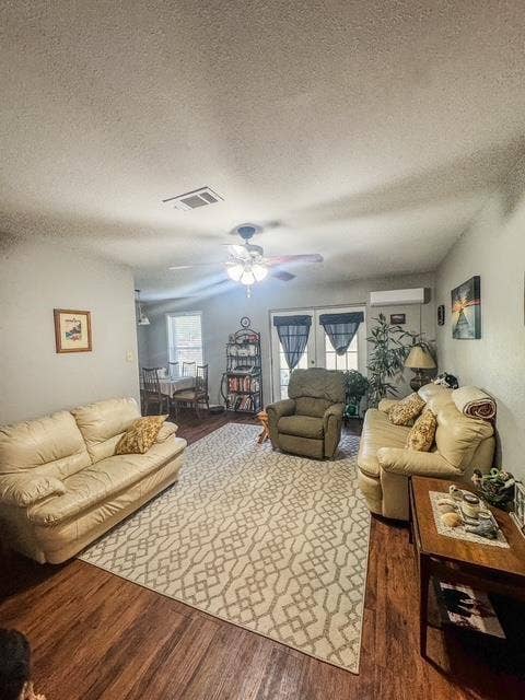 5230 Fm 2495, Athens, TX 75752 Spacious living area featuring rich wood-finish flooring, a ceiling fan, and light-toned walls