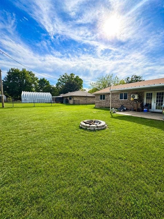5230 Fm 2495, Athens, TX 75752 Spacious backyard featuring a stone-ringed fire pit and extensive lawn