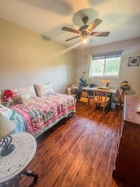 5230 Fm 2495, Athens, TX 75752 Room featuring wood-finish flooring, a ceiling fan with integrated lighting, and a window providing natural illumination