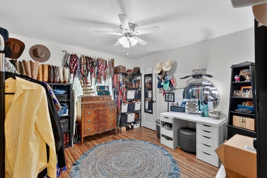 224 Hudson Avenue, Crowley, TX 76036 Spacious room featuring wood-finish flooring, a ceiling fan, and white walls