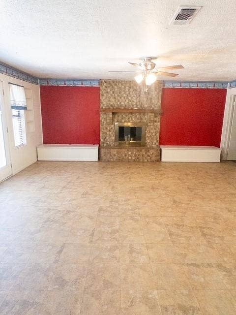 613 Laurel Road, Athens, TX 75751 Stone-clad fireplace with a metal insert, flanked by built-in bench seating and shelving