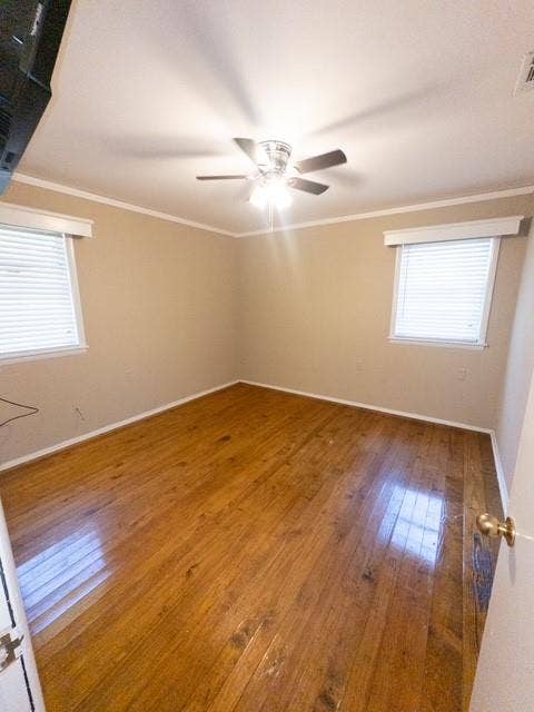 613 Laurel Road, Athens, TX 75751 Room featuring wood-finish flooring, light-toned wall paint, and white trim