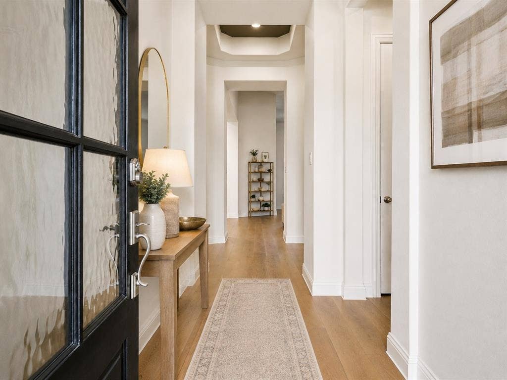 Entryway into a single story home in Lantana. This image has been virtually enhanced for marketing purposes.