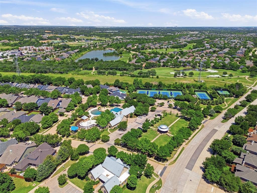 Expansive aerial highlighting a residential community with mature landscaping