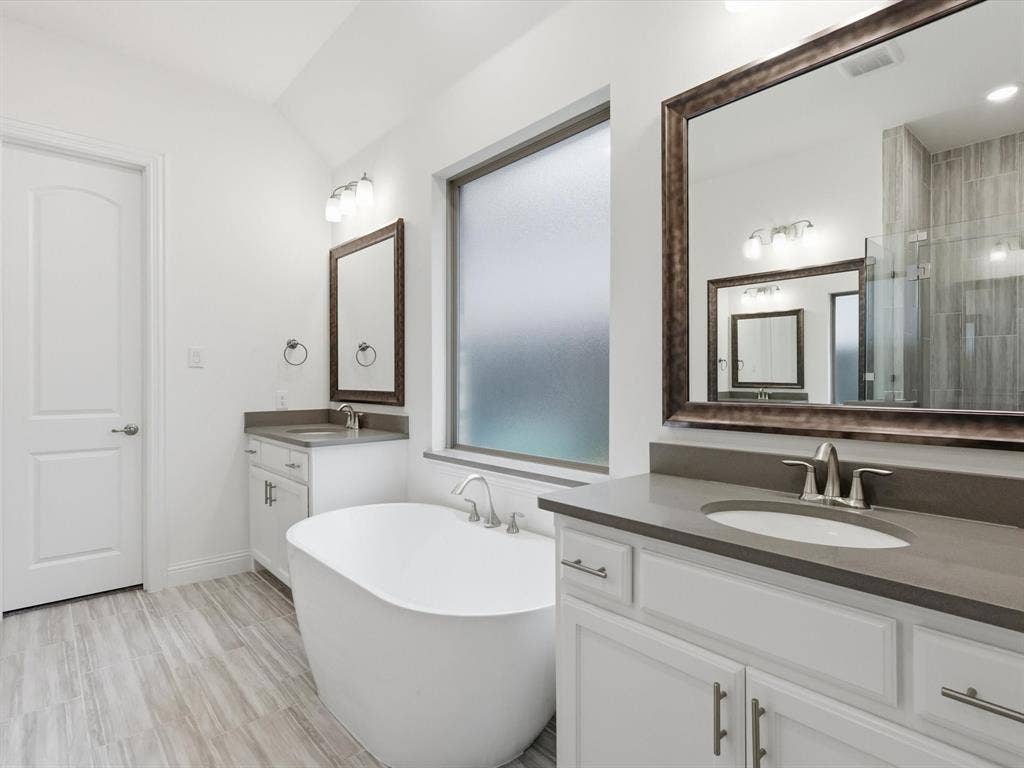 Well-appointed primary bath with functional layout and modern finishes.