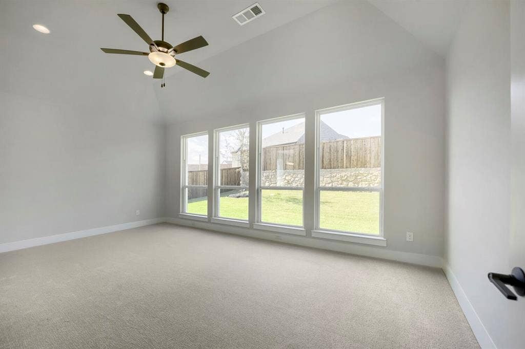 800 Blackberry Road, Haslet, TX 76052 Room featuring a vaulted ceiling with a ceiling fan, recessed lighting, and light-colored carpeting