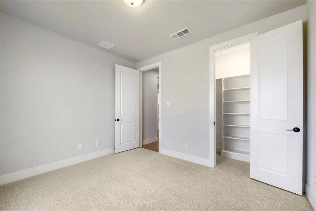 800 Blackberry Road, Haslet, TX 76052 Carpeted room with light neutral wall paint, white trim, and a ceiling light fixture