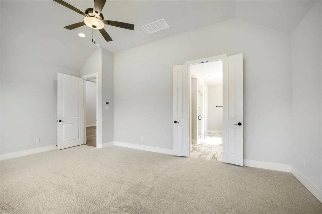 800 Blackberry Road, Haslet, TX 76052 Spacious room featuring vaulted ceilings, light-toned carpeting, and a ceiling fan with integrated lighting