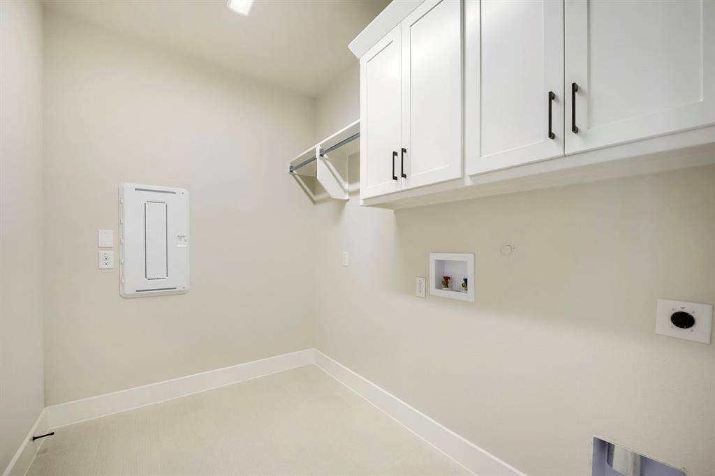 800 Blackberry Road, Haslet, TX 76052 Dedicated utility room featuring upper cabinetry with dark hardware, a wire shelf, and integrated lighting