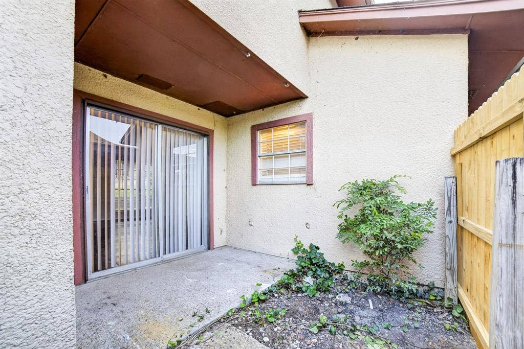 5618 Marina Drive, #32, Garland, TX 75043 Fenced courtyard with storage and patio doors