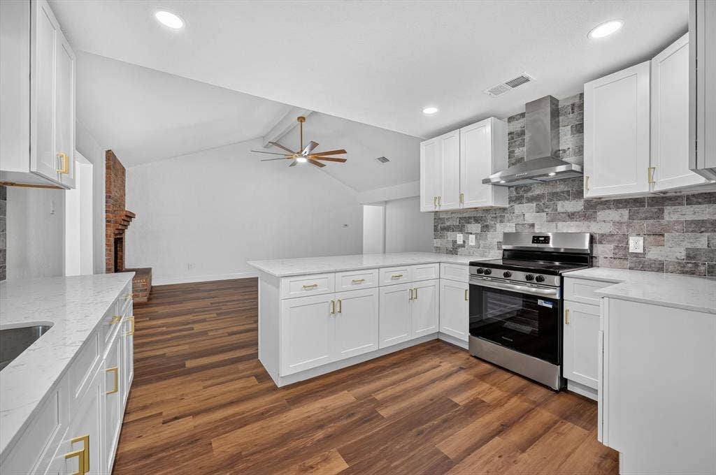 3420 Denbury Drive, Fort Worth, TX 76133 Modern kitchen featuring white cabinetry with gold-tone hardware, white countertops, and a full stainless steel appliance package