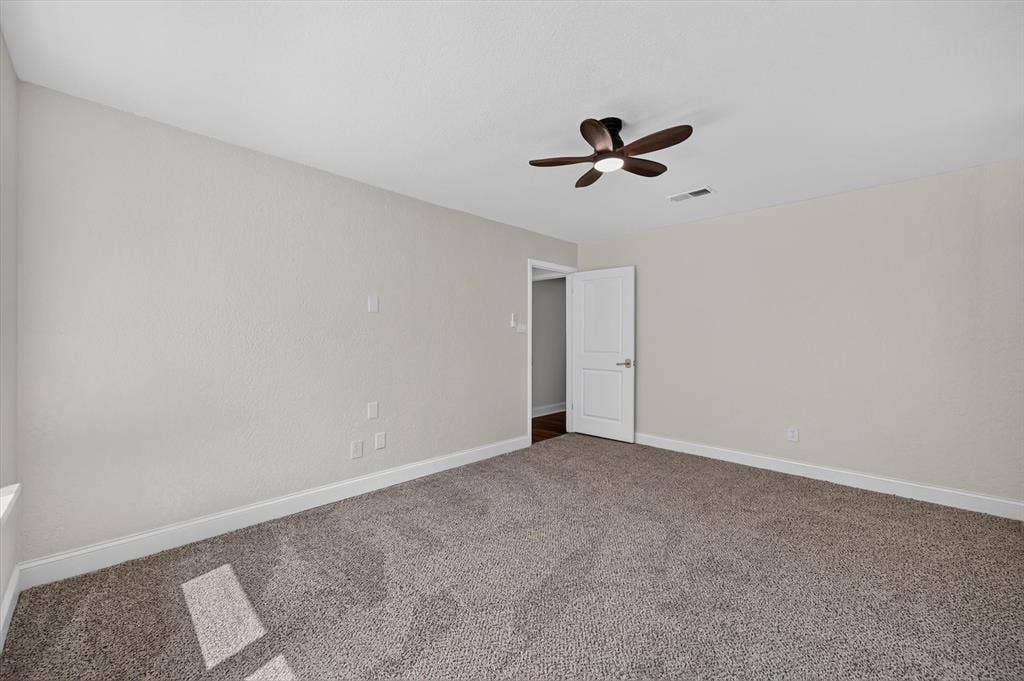 3420 Denbury Drive, Fort Worth, TX 76133 Carpeted room featuring light gray walls, a contemporary ceiling fan with integrated lighting, and white baseboards