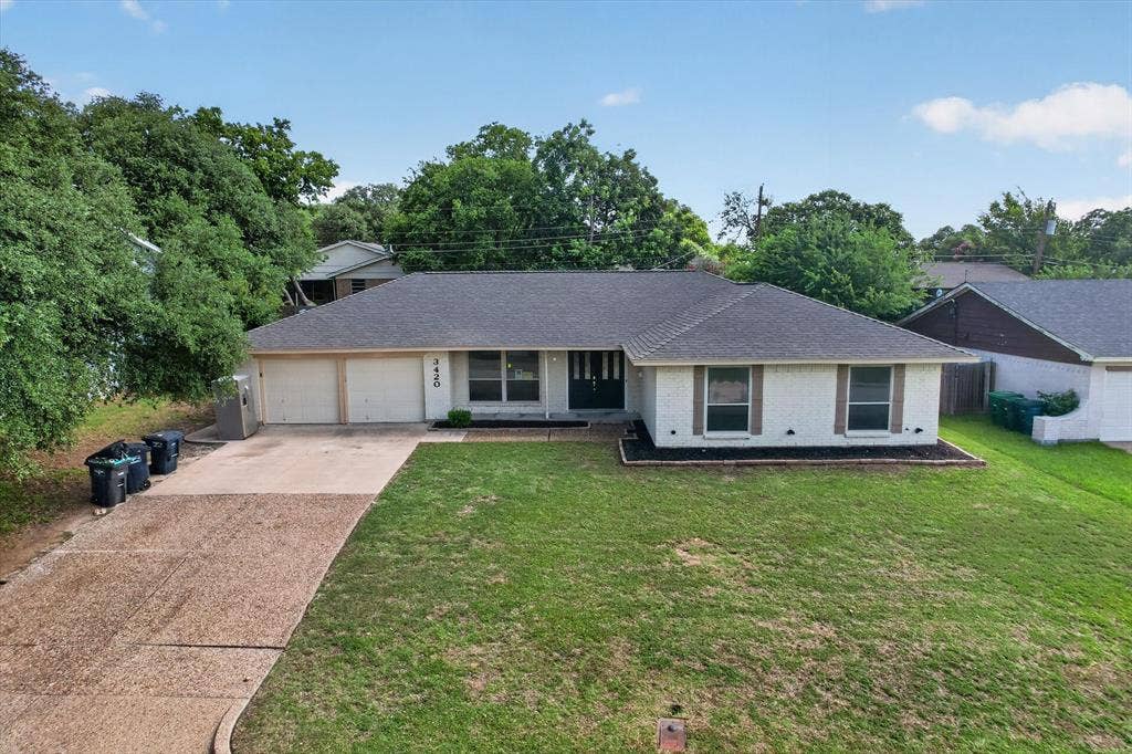 3420 Denbury Drive, Fort Worth, TX 76133 Single-story residence featuring a gray shingle roof and white exterior siding