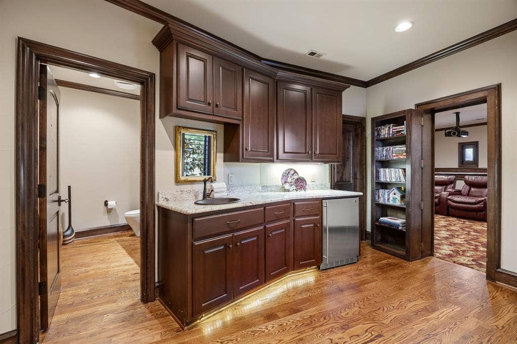 8 Meadowlake Drive, Heath, TX 75032 View of Wet Bar, Media Room and Attached Half Bathroom