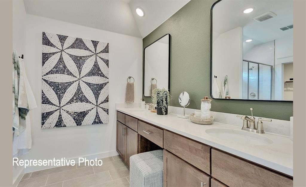 1579 Gentle Night Drive, Forney, TX 75126 Dual vanity with undermount sinks, brushed nickel fixtures, and a light-toned countertop