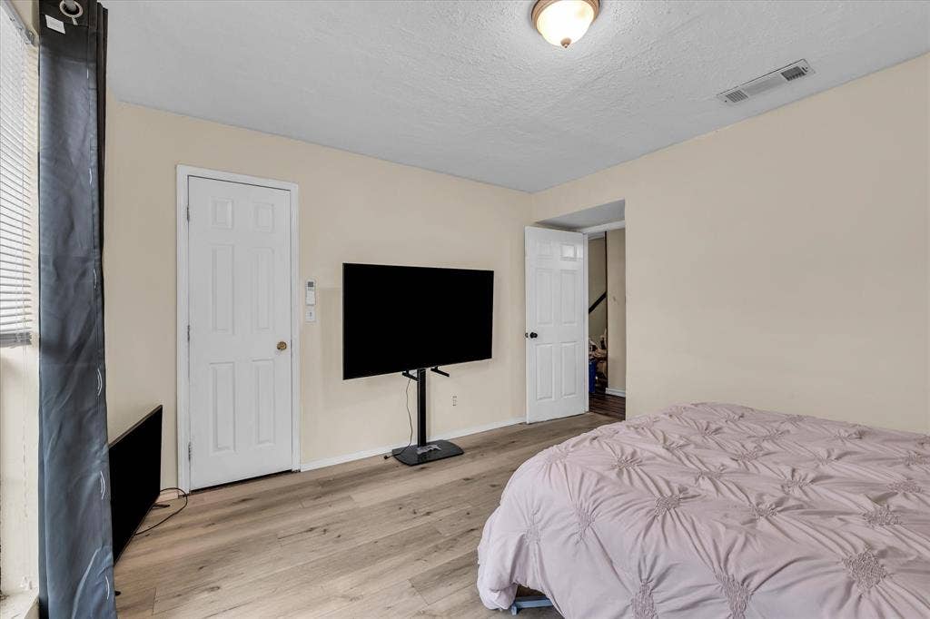 12912 Spring Valley Road, Moody, TX 76557 Room featuring wood-finish flooring, light neutral wall paint, and white trim