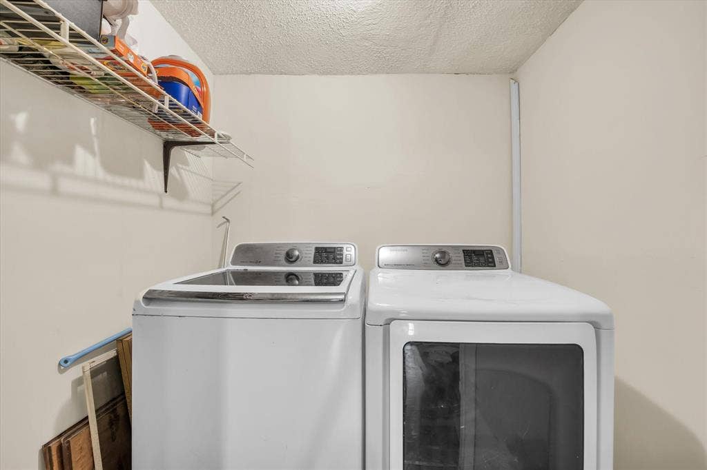 12912 Spring Valley Road, Moody, TX 76557 Dedicated laundry area featuring a wire storage shelf