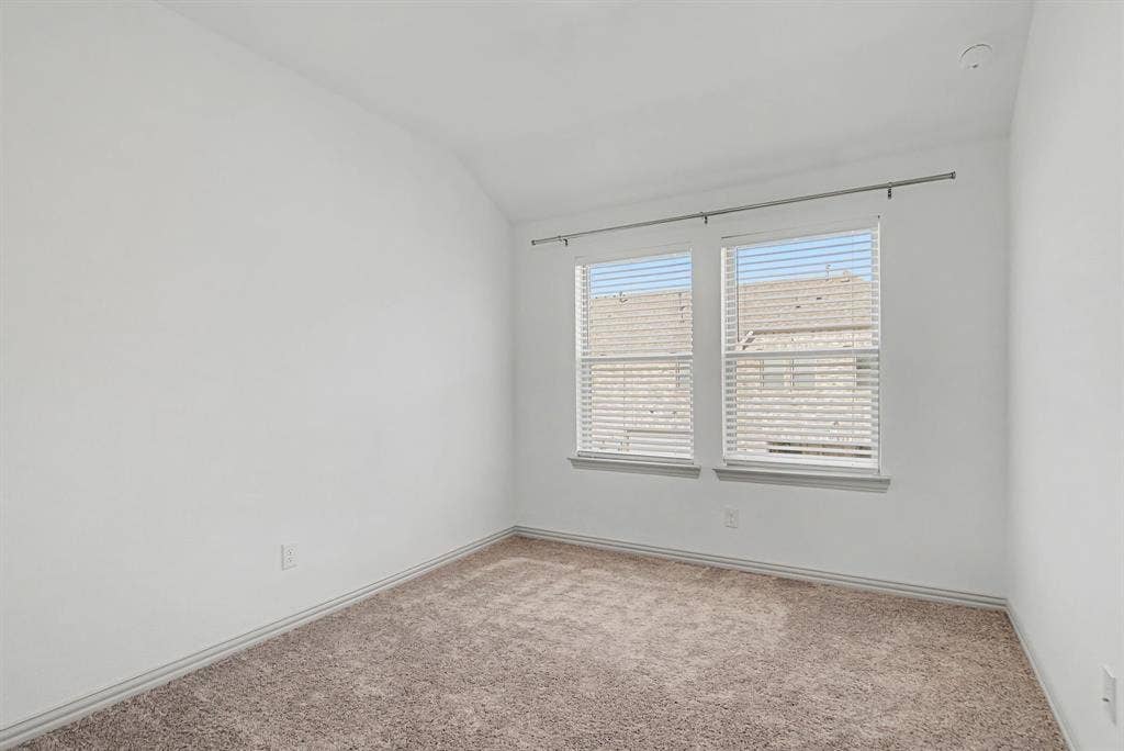 6032 Silverado Trail, McKinney, TX 75070 Neutral white walls, plush carpet flooring, and white trim