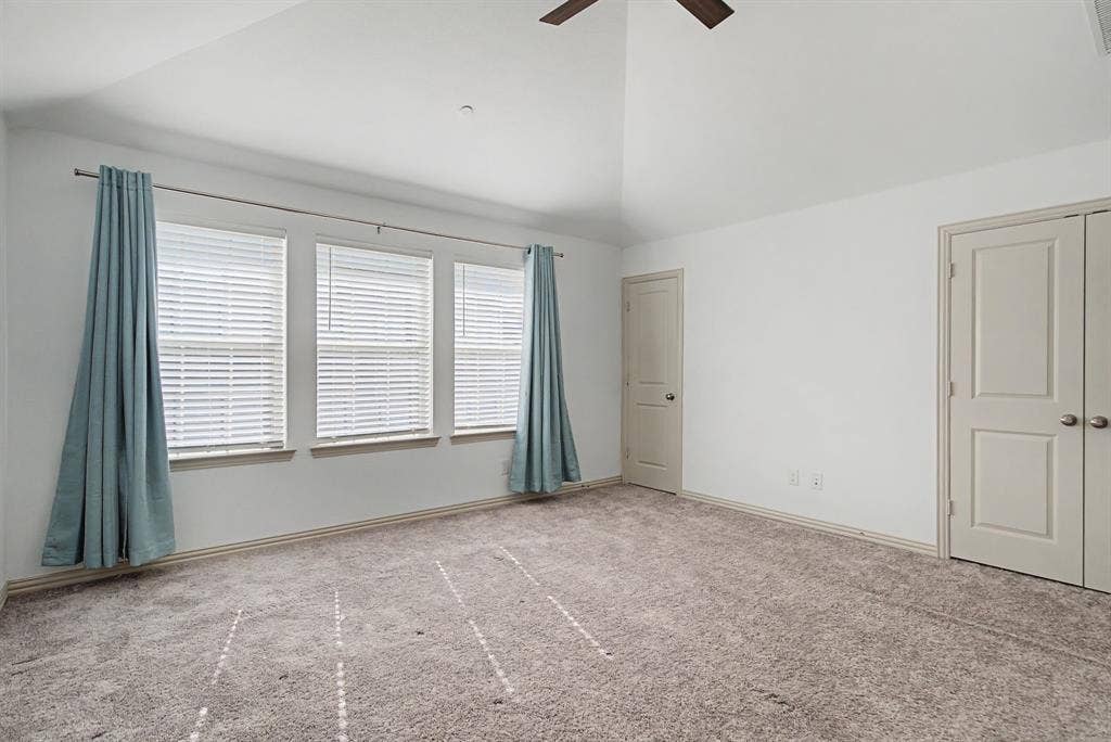 6032 Silverado Trail, McKinney, TX 75070 Vaulted ceiling room with ceiling fan and carpet flooring