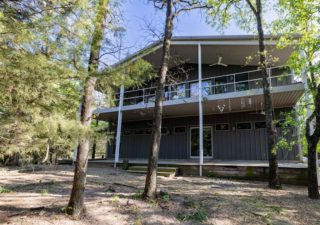 7500 sq ft Barndominium with 5000 sq ft of living space and a 2500 sq ft workshop featuring a 4-car garage, office and full bath.