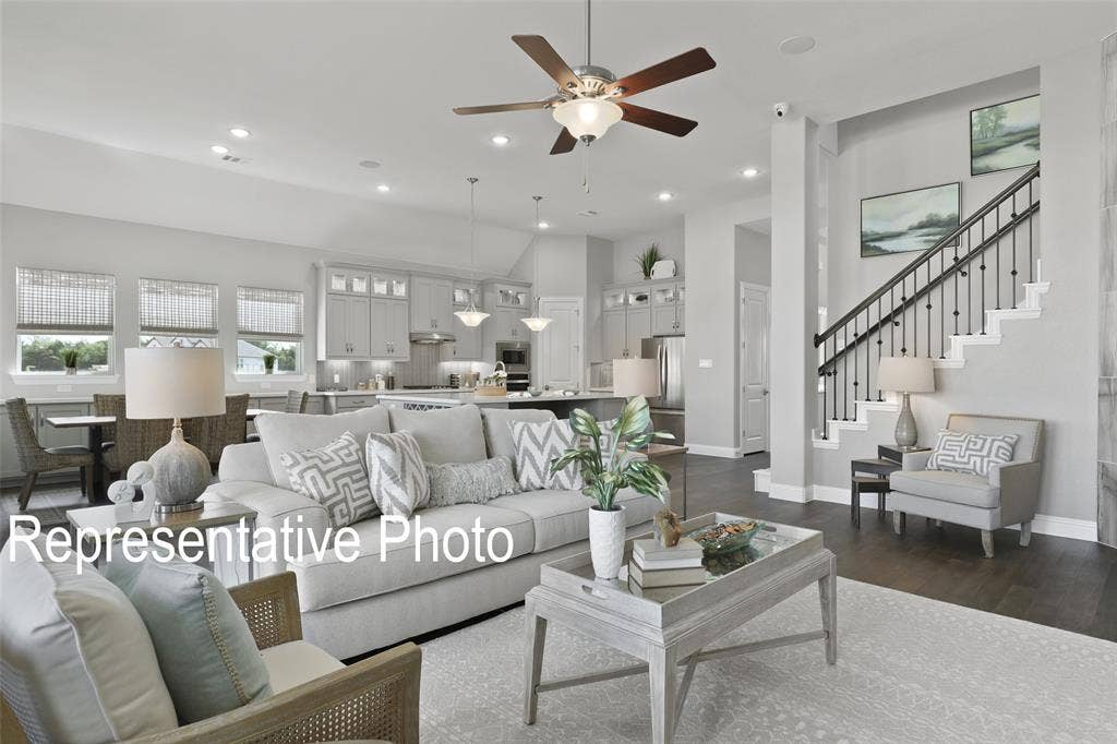 4384 Laurel Trail, Midlothian, TX 76065 Expansive open-concept living area featuring dark wood-finish flooring and a decorative ceiling fan