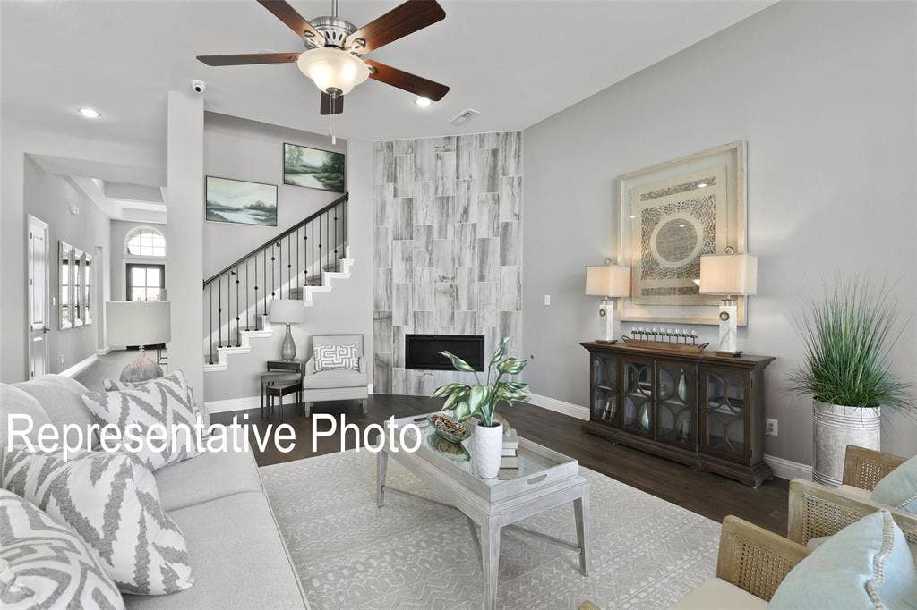 4384 Laurel Trail, Midlothian, TX 76065 Living area featuring dark wood-finish flooring and a light-toned area rug