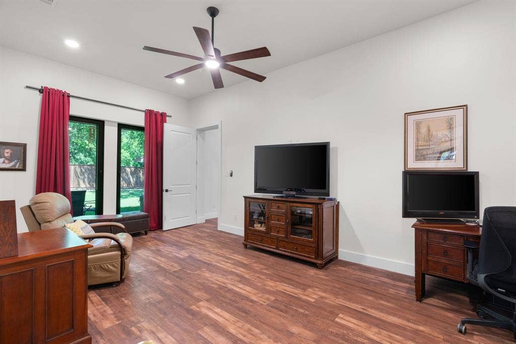 3621 Fritz Lane, Corinth, TX 76208 Spacious room featuring wood-finish flooring and a ceiling fan with integrated lighting