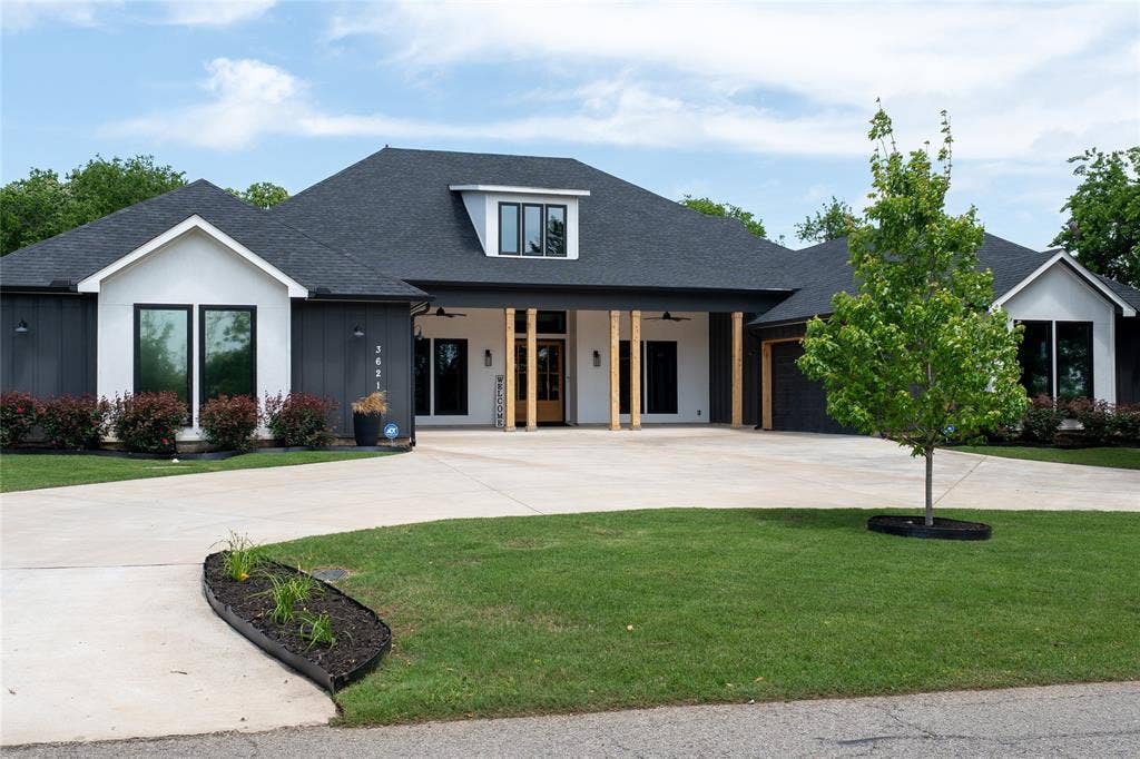 3621 Fritz Lane, Corinth, TX 76208 Modern farmhouse exterior featuring dark vertical siding and white gables