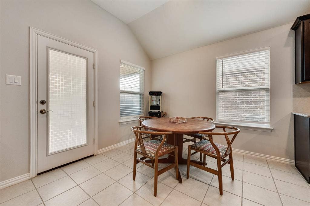 1432 Westview Lane, Northlake, TX 76226 Dining area off of kitchen with ceramic tile floors and door to back yard at 1432 Westview Ln in the Canyon Falls community in Northlake, TX
