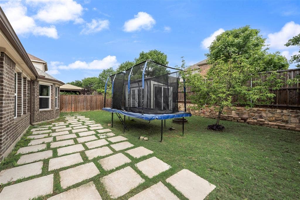 1432 Westview Lane, Northlake, TX 76226 Backyard with concrete pavers and storage shed at 1432 Westview Ln in the Canyon Falls community in Northlake, TX