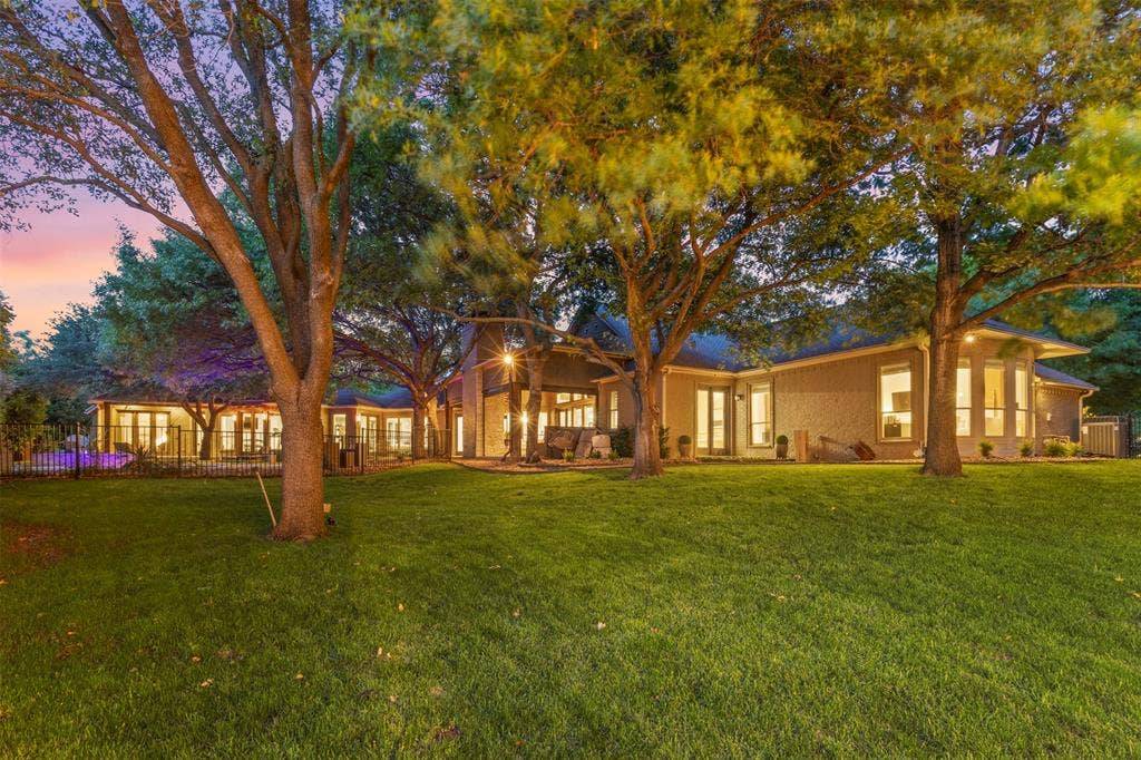 8663 Elm Court, Frisco, TX 75033 manicured trees and grass