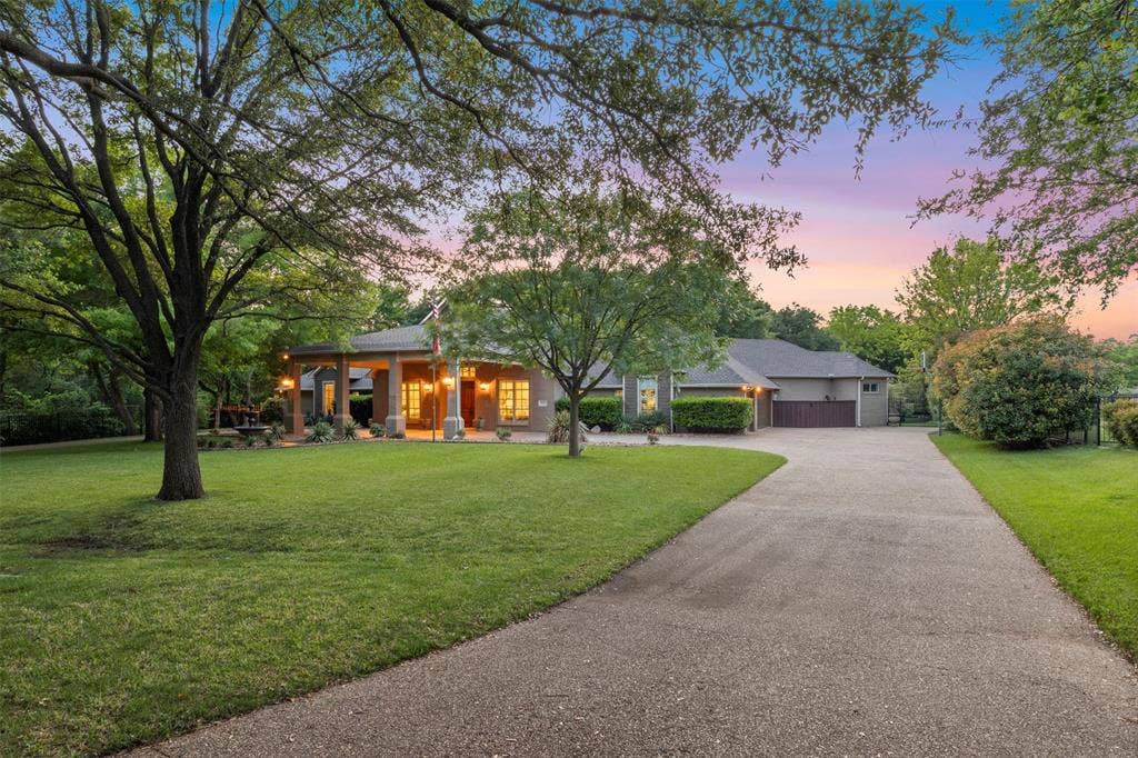 8663 Elm Court, Frisco, TX 75033 long driveway leading to porte cochere and 3 car garage