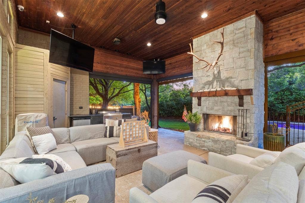 8663 Elm Court, Frisco, TX 75033 outdoor living w massive stone fireplace and wood ceiling