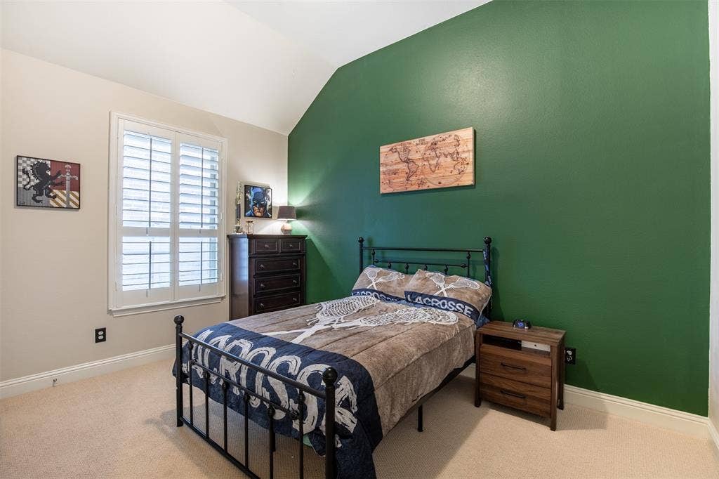 1408 9th Street, Argyle, TX 76226 A good-sized secondary bedroom featuring a walk-in closet, offering both comfort and excellent storage space.