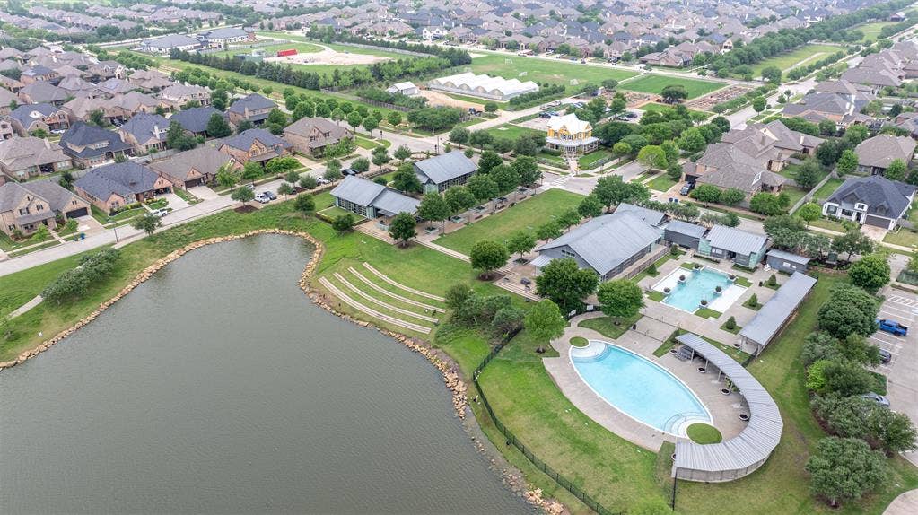1408 9th Street, Argyle, TX 76226 The Harvest community offers fantastic amenities, including a beautiful pool and a well-equipped fitness center—perfect for relaxation, recreation, and an active lifestyle.