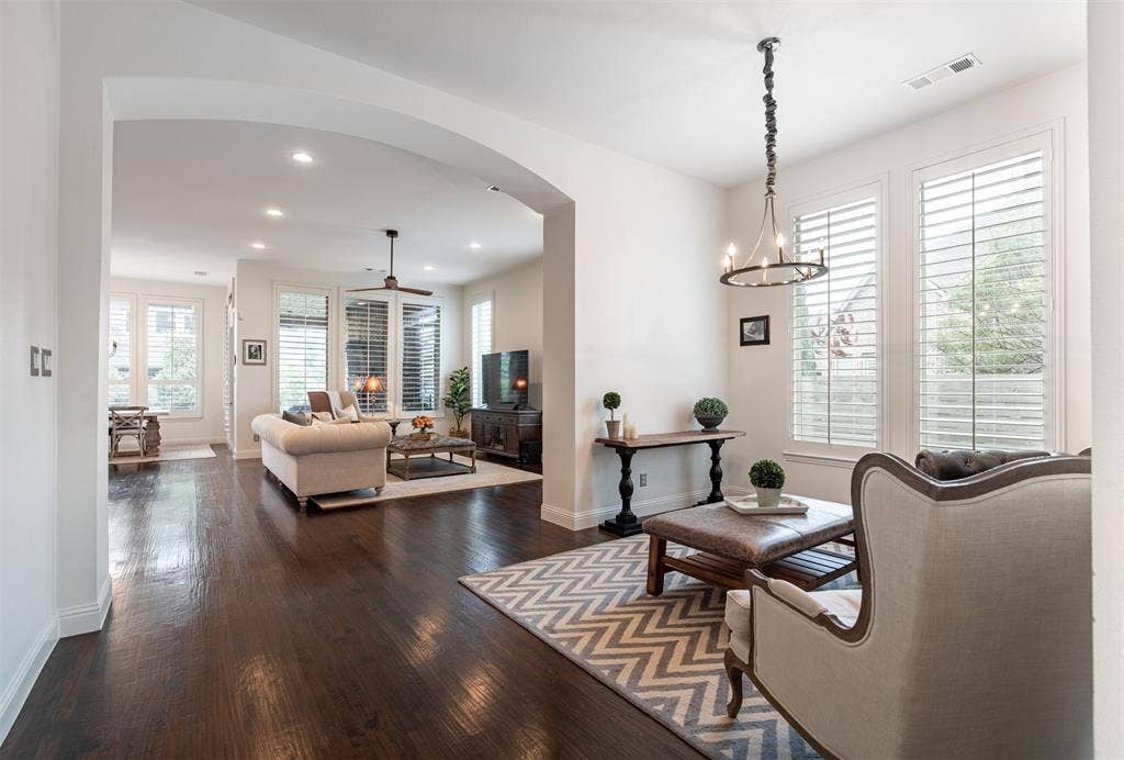 1408 9th Street, Argyle, TX 76226 The open-concept design of this home is ideal for entertaining, creating a seamless flow between living spaces that makes gathering with family and friends effortless.