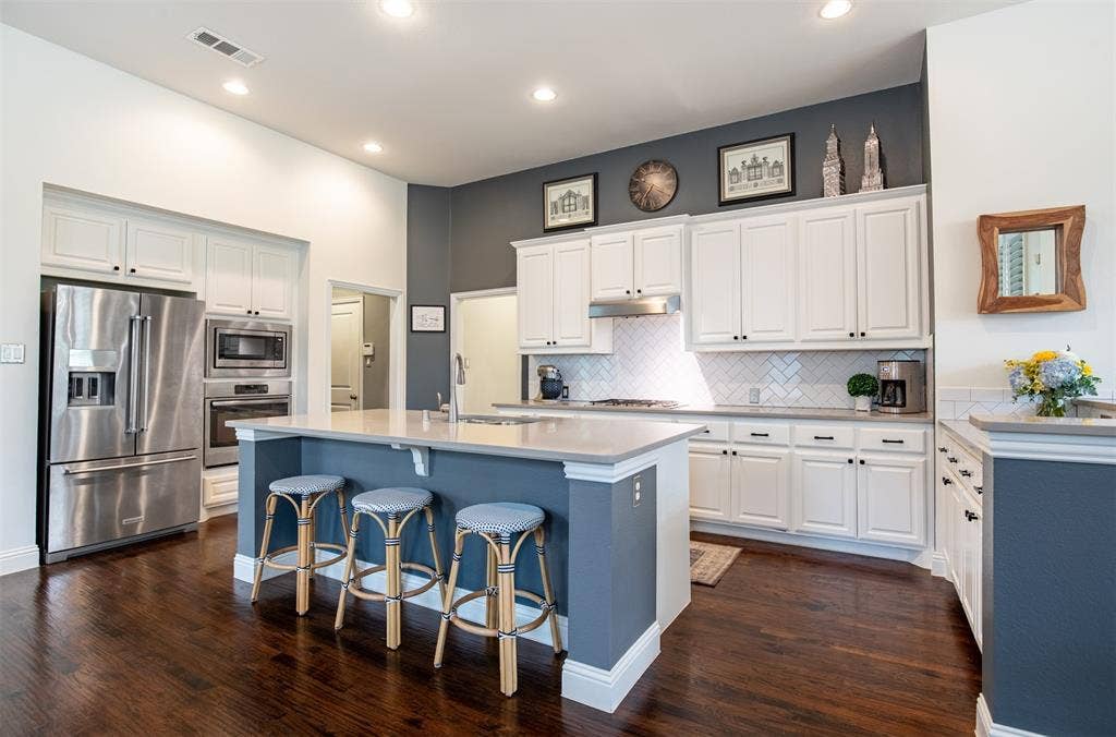 1408 9th Street, Argyle, TX 76226 This kitchen offers an abundance of cabinetry and counter space—truly a chef’s dream with plenty of room for cooking, prep, and storage.
