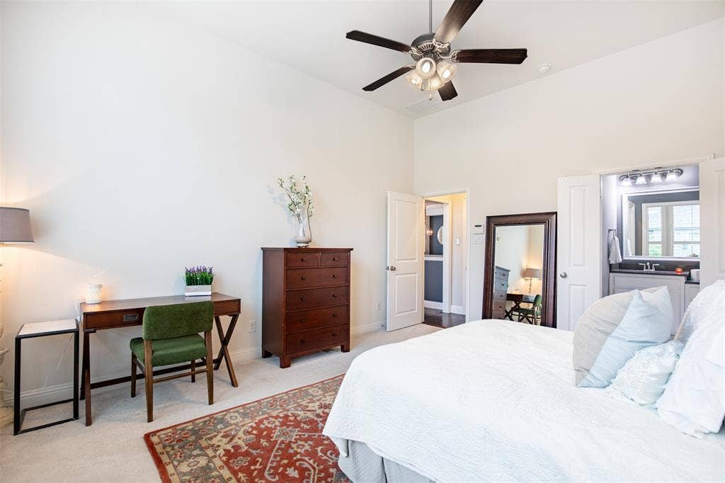1408 9th Street, Argyle, TX 76226 The oversized primary suite offers plenty of space for a comfortable sitting area, creating the perfect spot to relax and unwind.