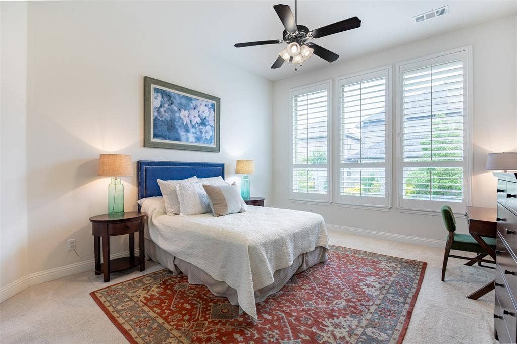 1408 9th Street, Argyle, TX 76226 The oversized primary suite is filled with natural light and features peaceful views overlooking the backyard, creating a serene and private retreat.
