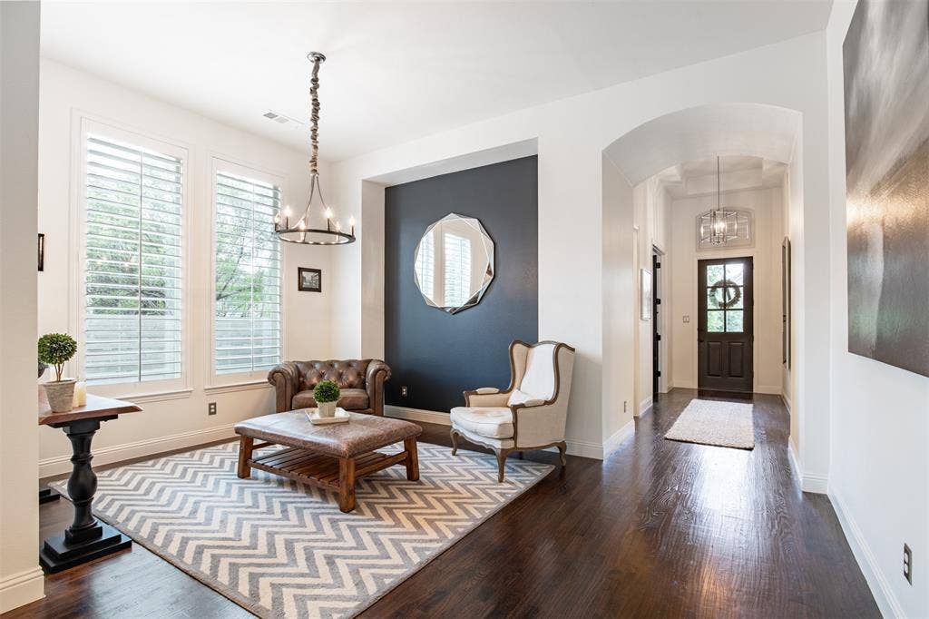 1408 9th Street, Argyle, TX 76226 The formal dining space is currently being enjoyed as a cozy sitting area—perfectly versatile and effortlessly inviting!