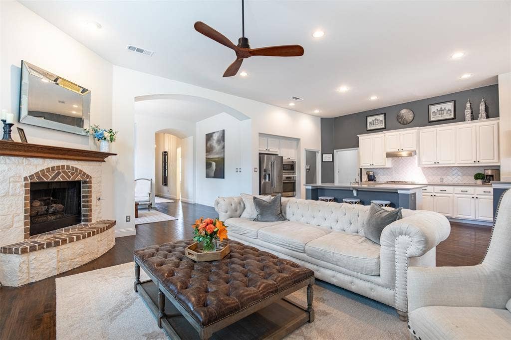 1408 9th Street, Argyle, TX 76226 The living room opens seamlessly to the gourmet kitchen, creating an ideal layout for both everyday living and effortless entertaining.