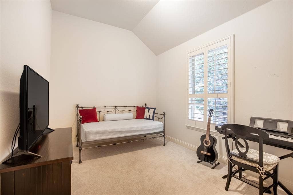 1408 9th Street, Argyle, TX 76226 Another secondary bedroom also features a walk-in closet, providing ample storage and a comfortable space for family or guests.