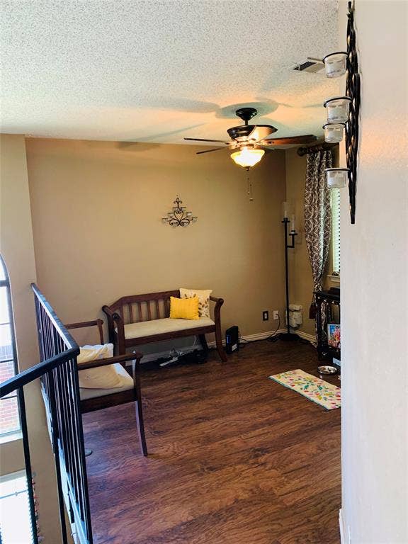 1848 Sonnet Drive, Grapevine, TX 76051 Upper-level space featuring wood-finish flooring, a ceiling fan with integrated lighting, and a metal railing