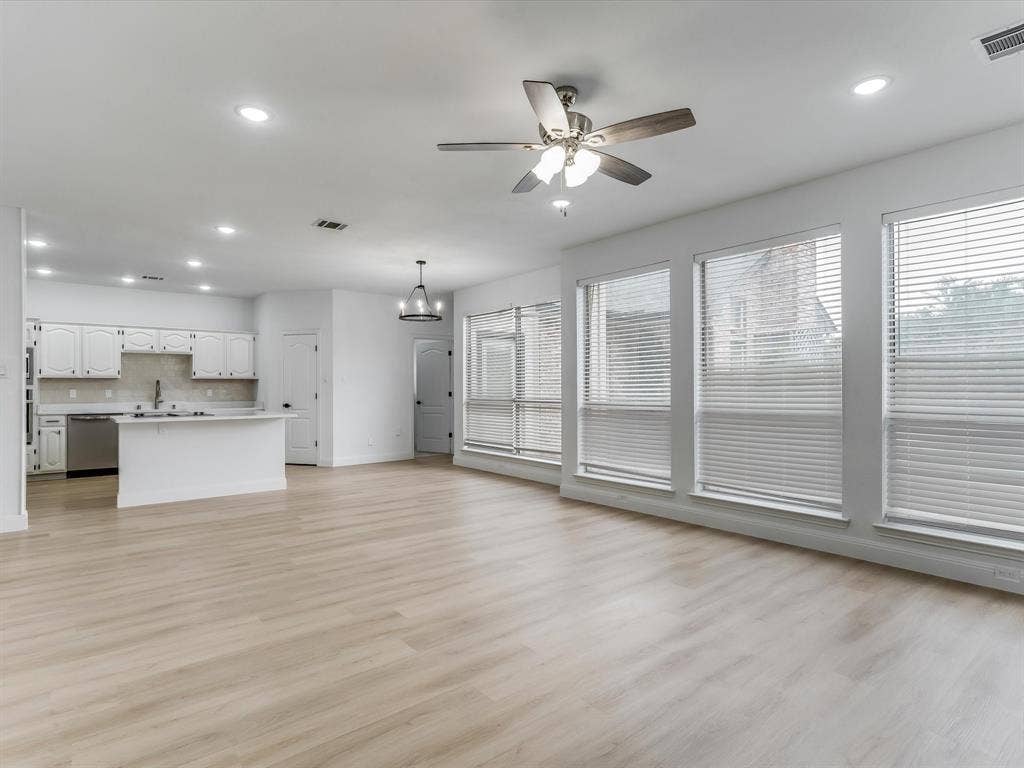 736 Sunkist Lane, Plano, TX 75025 Open-concept living area featuring light wood-finish flooring, recessed lighting, and a contemporary ceiling fan