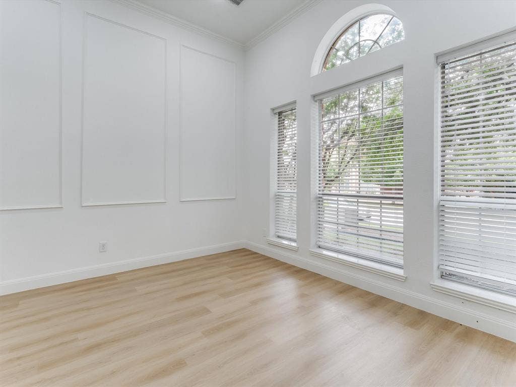 736 Sunkist Lane, Plano, TX 75025 Room featuring high ceilings, wood-finish flooring, and white baseboards