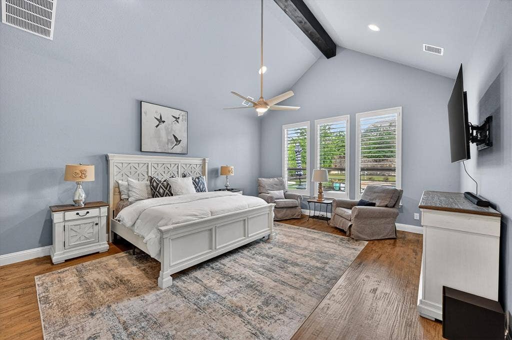 7108 Eagles Ridge Court, Argyle, TX 76226 The private primary suite is a true retreat, with direct laundry room access, two expansive custom walk-in closets, and a spa-like bath featuring an oversized semi-frameless shower, soaking tub, and separate granite vanities.