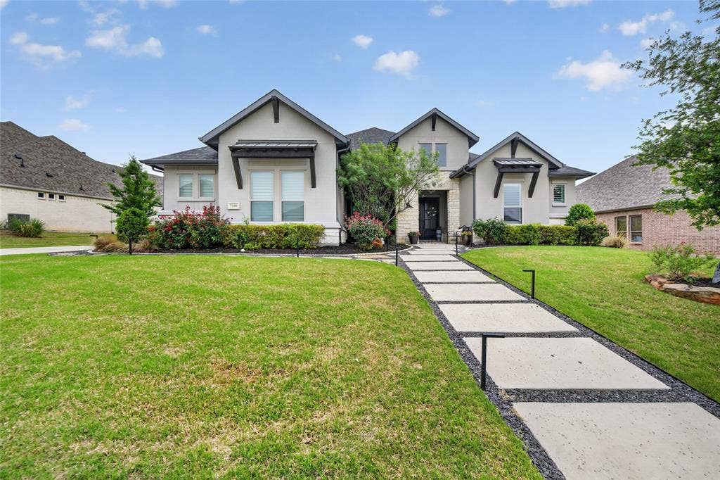 7108 Eagles Ridge Court, Argyle, TX 76226 Additional highlights include smart home automation, Jellyfish permanent exterior lighting, and a spacious three-car garage.