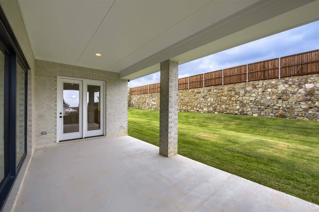 794 White Sage Road, Haslet, TX 76052 Covered concrete patio featuring recessed lighting, a light brick exterior, and glass panel french doors