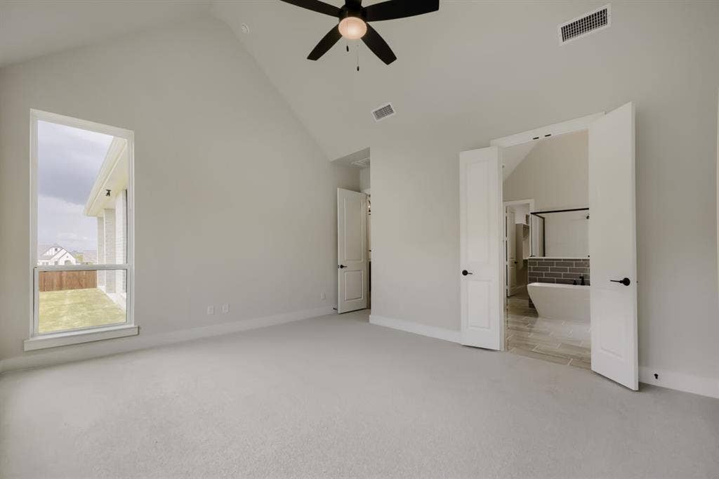 794 White Sage Road, Haslet, TX 76052 Vaulted ceiling bedroom with a large window and light-toned carpeting