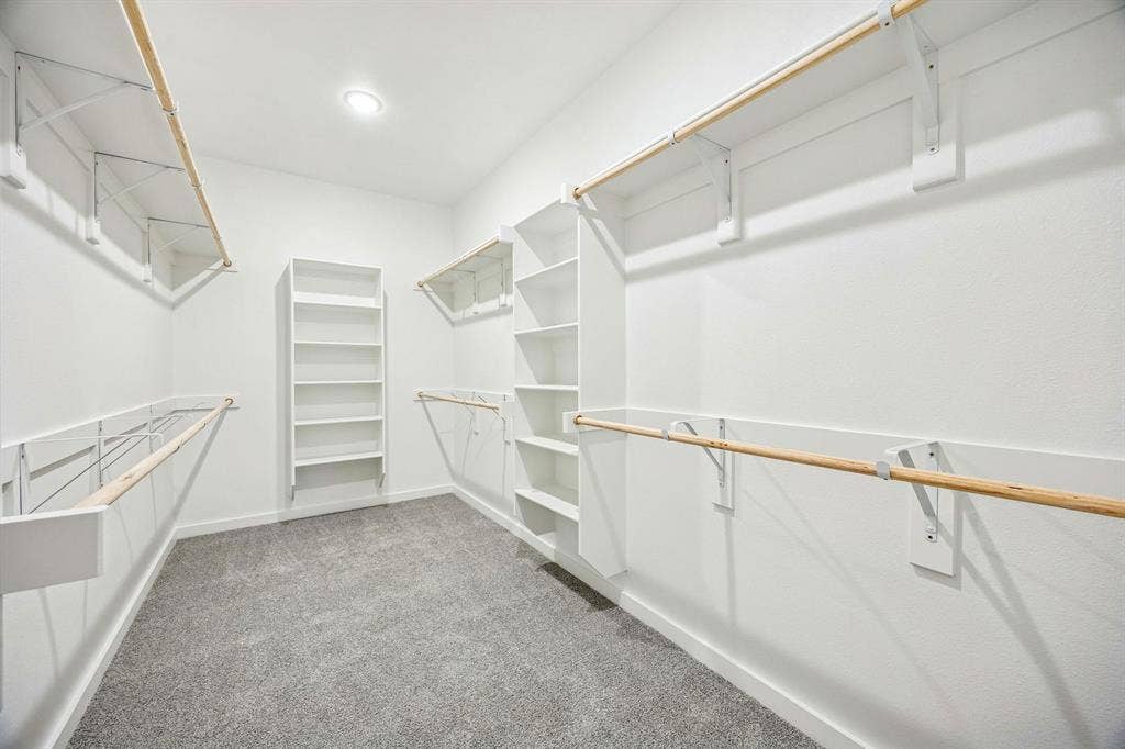 Primary Closet in the Willow home plan by Trophy Signature Homes – REPRESENTATIVE PHOTO